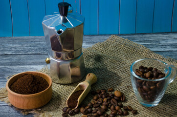 Still life with coffee beans on the wooden background