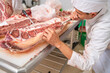 butcher Use a knife separate the bone from the meat at table in the slaughterhouse, Wagyu Beef, Meat industry,
