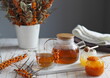 © Татьяна Пинкасевич - Medical herbal background with medicinal sea buckthorn and healthy natural herbal tea. Protect yourself from colds and flu during a cold snap.