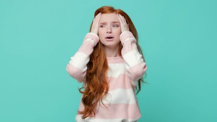 Wall Mural - Displeased shocked irritated ginger redhead young girl in white pink sweater isolated on blue turquoise background in studio. People lifestyle concept. Looking camera ask what spreading hands swearing