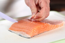 Removing Bones From Salmon Fillet. Making Salmon In Puff Pastry Series.