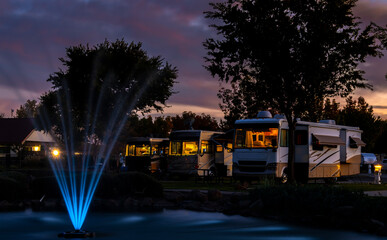 Evening at the Rv park by a water fountain and under a colorful sunset sky