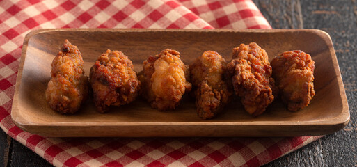 Wall Mural - Breaded and Fried Oysters on a Rustic Wooden Table