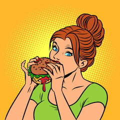 A woman eats a Burger