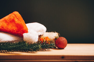 santa claus hat and wooden table. 