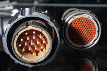 Poster - round electrical connectors in dark. two electrical connectors. connectors for connecting to electri