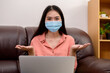 © PK Studio - woman in face mask with laptop during Learning at home