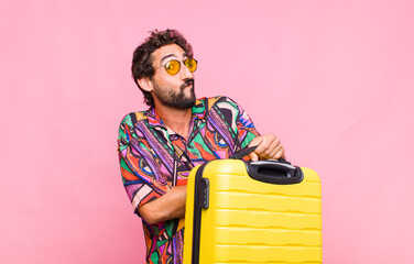 Poster - young bearded man shrugging, feeling confused and uncertain, doubting with arms crossed and puzzled look