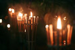 Row of bamboo Torches flaming at night