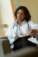 Wall Mural - Portrait of african-american woman doctor working in hospital