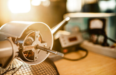 Wall Mural - Close-up of iron motor from home cooling fan lies on a table