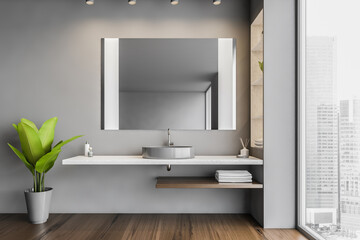 Dark open space bathroom with sink and mirror and a big window