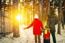 Family Walking In Winter
