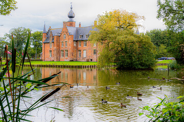 Castle in the envirement of Roeselare surrounded by ducks, sterrebos public domain at Rumbeke.  Ducks living peacefull at castle.