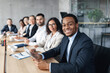 © Prostock-studio - African Businessman On Corporate Meeting With Colleagues Sitting In Office