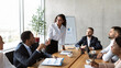 © Prostock-studio - Businesswoman On Business Meeting Talking With Colleagues Standing In Office