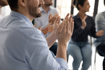 Wall Mural - Excellent report. Close up of diverse multiethnic audience millennial men and women sitting on chairs clapping hands to speaker lecturer appreciating for good speech grateful for useful information