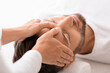 © Prostock-studio - Peaceful man getting healing head massage at spa