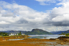 The Bay Near The Village Of Plockton. Plockton Is A Picturesque Highland Village That Sits On A Sheltered Bay With Stunning Views Overlooking Loch Carron Of Scotland In The County Of Ross And Cromarty