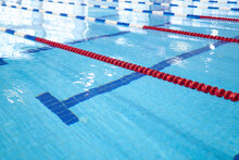 Fragment Of The Competition Pool With Blue Water And Marked Swimming Lanes