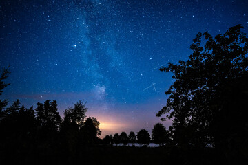 Wall Mural - overhead milky way with stars in clear summer night. old barn house. country side.