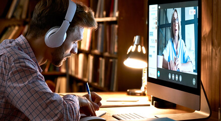male student wearing headphones conference video calling, watching webinar, online training class, v