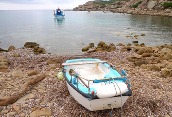 fishing boat at cala del vino, alghero, sardinia, italy