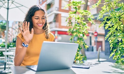 Poster - Young african american student girl doing video call using laptop.