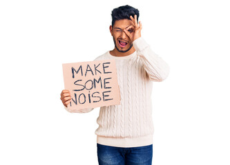 Sticker - Handsome latin american young man holding make some noise banner smiling happy doing ok sign with hand on eye looking through fingers