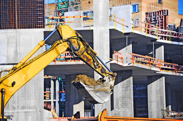 Excavating machine on construction site