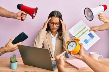 Sticker - Beautiful hispanic woman working at the office under stress suffering from headache desperate and stressed because pain and migraine. hands on head.