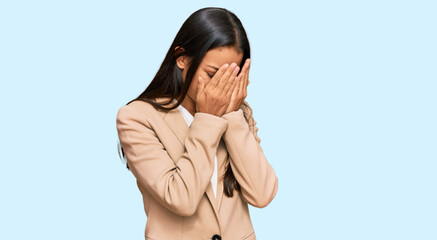 Poster - Beautiful hispanic woman wearing business jacket with sad expression covering face with hands while crying. depression concept.