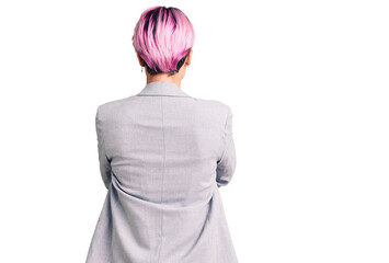 Canvas Print - Young beautiful woman with pink hair wearing casual clothes standing backwards looking away with crossed arms