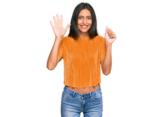 Sticker - Young brunette arab woman wearing casual clothes showing and pointing up with fingers number six while smiling confident and happy.