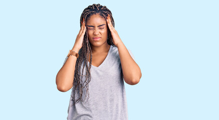 Poster - Young african american woman with braids wearing casual clothes suffering from headache desperate and stressed because pain and migraine. hands on head.