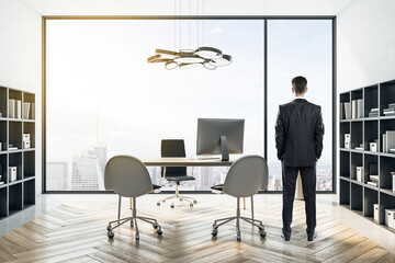 Poster - Businessman standing in modern coworking office