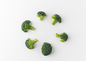 Fresh Healthy vegetables and food. Raw broccoli cut into small pieces and put on white table background.