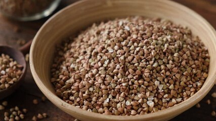 Wall Mural - Green buckwheat groats in a bowl. Healthy porridge. Vegan vegetarian food