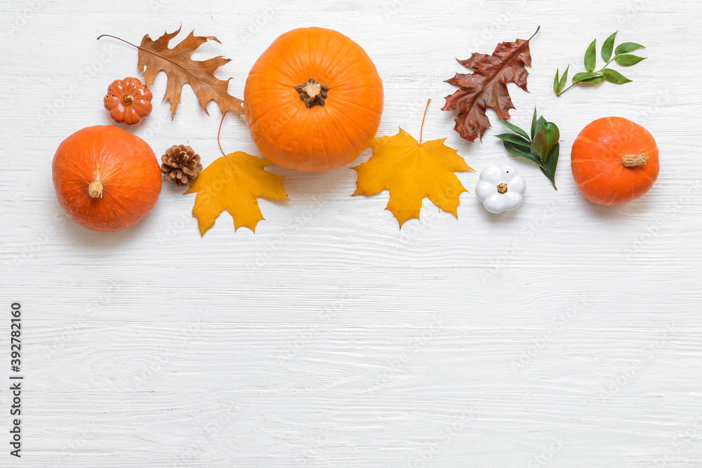Beautiful autumn composition on white wooden background