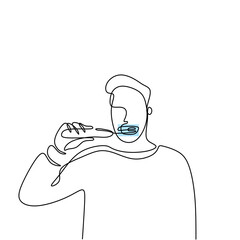 One continuous drawing line young man brushes her teeth early in the morning or in the night. Character of a man in pajamas sadly brushing his teeth. Dental hygiene concept. Minimalism design