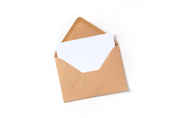 Wall Mural - Greeting card in a brown kraft envelope mockup, shot from above on a white background with a place for text