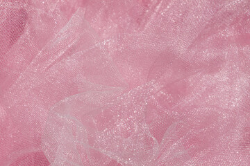 Wall Mural - Pink tulle fabric texture top view. Coral background. Fashion color trends feminine tutu skirt flat lay, female blog backdrop for text signs desidgn. Girly abstract wallpaper, textile surface.