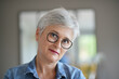 © goodluz - portrait of a beautiful smiling 50-year-old woman with white hair