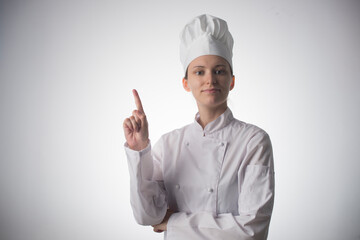 Wall Mural - Chef woman. Isolated on gray background