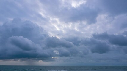 Wall Mural - dramatic stormy dark clouds covering sky before rain. cloudy sky rainy in season in topical country.