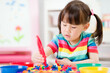© M-image - young girl play math and color sorting fine motor skill game for  homeschooling