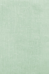 Green linen pastel fabric, background or texture, closeup, top view