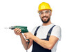 © Syda Productions - profession, construction and building - happy smiling male worker or builder in helmet and goggles with drill over white background