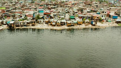 Wall Mural - Slum area in Manila, Phillippines, top view. lot of garbage in the water.