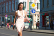 © Andrey_Arkusha - Beautiful brunette woman in sexy pink dress